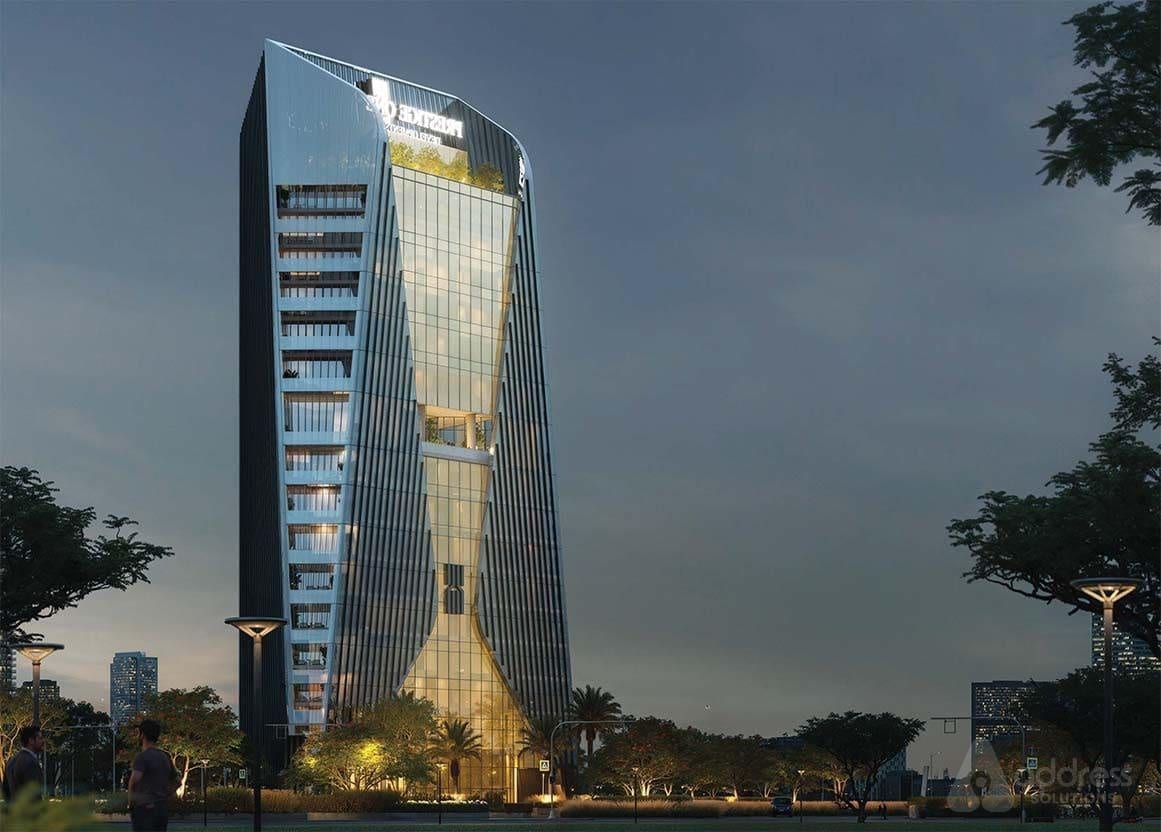Modern commercial office tower at night